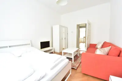Ein Bett oder Betten in einem Zimmer der Unterkunft UNIVERSUM APARTMENT 3