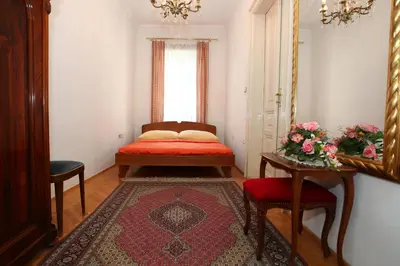 Ein Bett oder Betten in einem Zimmer der Unterkunft Mozart Apartments - Rögergasse