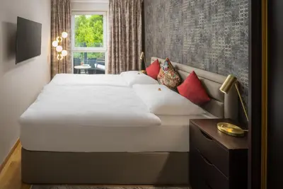 Ein Bett oder Betten in einem Zimmer der Unterkunft Abieshomes Serviced Apartments Schönbrunn