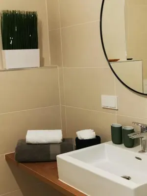 Ein Badezimmer in der Unterkunft My TrIIIple Ferienwohnung zwischen City und Prater