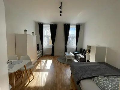 Ein Bett oder Betten in einem Zimmer der Unterkunft K City Apartments Märzstraße