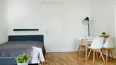 Ein Bett oder Betten in einem Zimmer der Unterkunft K City Apartments Märzstraße