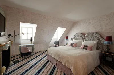 Ein Bett oder Betten in einem Zimmer der Unterkunft The Leo Grand
