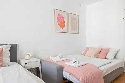 Ein Bett oder Betten in einem Zimmer der Unterkunft 2 BR City Apartment in Neubau, 6 min to city center