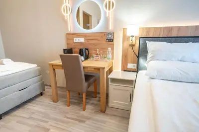 Ein Bett oder Betten in einem Zimmer der Unterkunft Elegance Studios