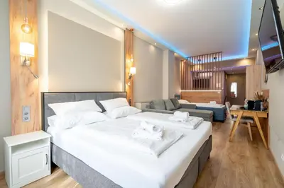 Ein Bett oder Betten in einem Zimmer der Unterkunft Elegance Studios