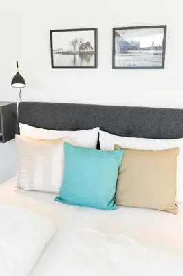 Ein Bett oder Betten in einem Zimmer der Unterkunft Rooftop Apartments mit großer Terrasse