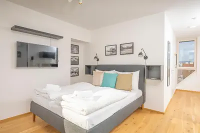 Ein Bett oder Betten in einem Zimmer der Unterkunft Rooftop Apartments mit großer Terrasse