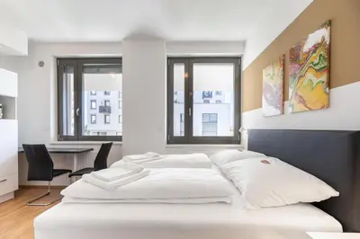 Ein Bett oder Betten in einem Zimmer der Unterkunft FeelGood Apartments LakeLiving inklusive Garagenplatz
