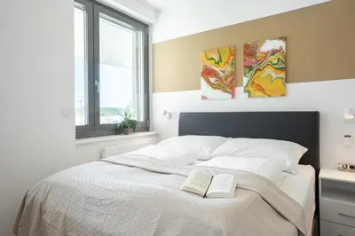Ein Bett oder Betten in einem Zimmer der Unterkunft FeelGood Apartments LakeLiving inklusive Garagenplatz