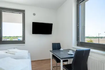 Ein Bett oder Betten in einem Zimmer der Unterkunft FeelGood Apartments LakeLiving inklusive Garagenplatz