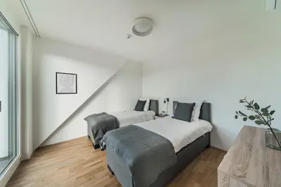 Ein Bett oder Betten in einem Zimmer der Unterkunft Arbio I Liv's Place Lux Apartments
