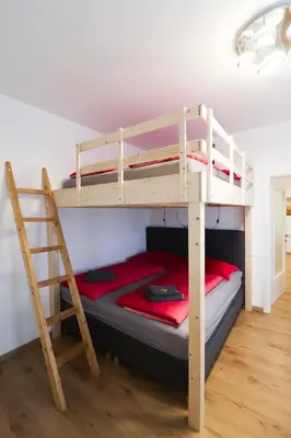 Ein Bett oder Betten in einem Zimmer der Unterkunft CozyNite Premium Apartment Schönbrunn 1