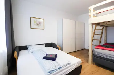 Ein Bett oder Betten in einem Zimmer der Unterkunft CozyNite Premium Apartment Schönbrunn 1
