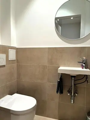 Ein Badezimmer in der Unterkunft Casa Nostra - Moderne lichtdurchflutete Wohnung am Augarten