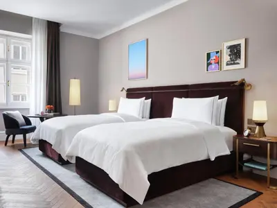 Ein Bett oder Betten in einem Zimmer der Unterkunft Rosewood Vienna