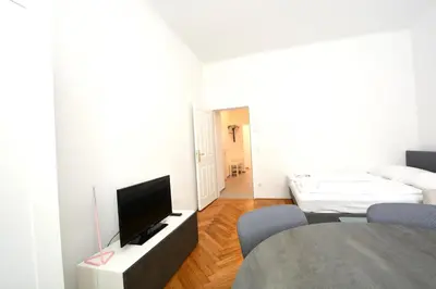 Ein Bett oder Betten in einem Zimmer der Unterkunft UNIVERSUM APARTMENT 4