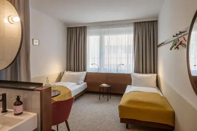 Ein Bett oder Betten in einem Zimmer der Unterkunft magdas HOTEL Vienna City - First Social Business HOTEL in Austria