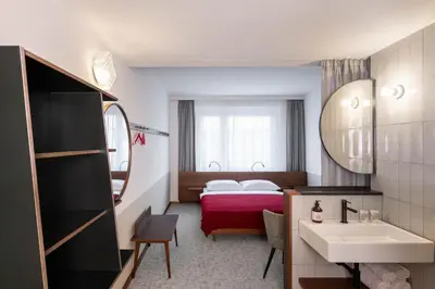 Ein Bett oder Betten in einem Zimmer der Unterkunft magdas HOTEL Vienna City - First Social Business HOTEL in Austria