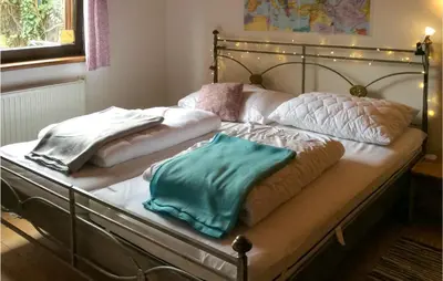 Ein Bett oder Betten in einem Zimmer der Unterkunft Ferienhaus-Wiendonaustadt