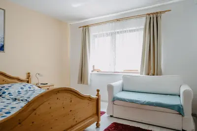 Ein Bett oder Betten in einem Zimmer der Unterkunft Ferienhaus RADO