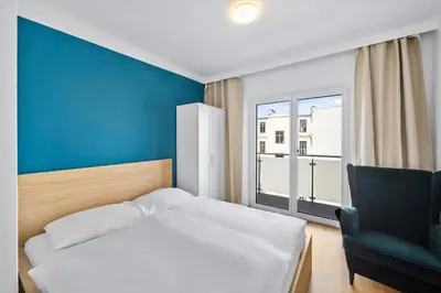 Ein Bett oder Betten in einem Zimmer der Unterkunft Flora Collection