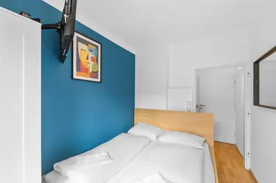 Ein Bett oder Betten in einem Zimmer der Unterkunft Flora Collection