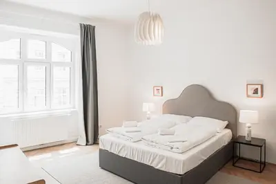 Ein Bett oder Betten in einem Zimmer der Unterkunft HeyMi Apartments Zentagasse