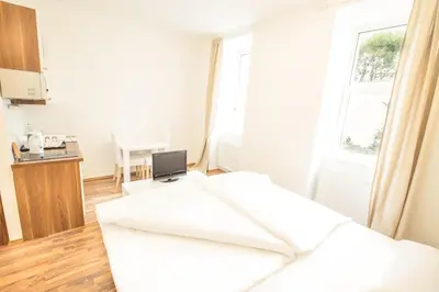 Ein Bett oder Betten in einem Zimmer der Unterkunft Grand Central Station Apartments I contactless check-in