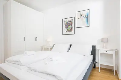 Ein Bett oder Betten in einem Zimmer der Unterkunft Ottakring Balcony Suite