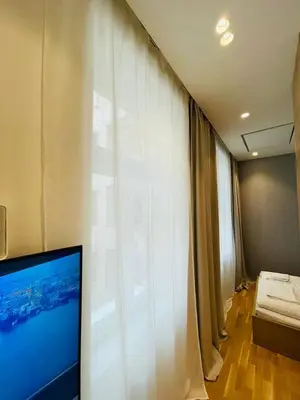 Ein Bett oder Betten in einem Zimmer der Unterkunft ZEUS Design Apartment Erlach #37