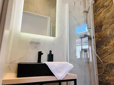 Ein Badezimmer in der Unterkunft ZEUS Design Apartment Erlach #37