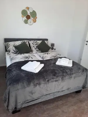 Ein Bett oder Betten in einem Zimmer der Unterkunft Ferienwohnungen Winzergasse