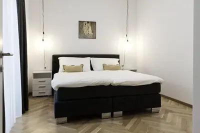 Ein Bett oder Betten in einem Zimmer der Unterkunft AAA All About Apartments