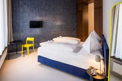 Ein Bett oder Betten in einem Zimmer der Unterkunft grätzlhotel Serviten