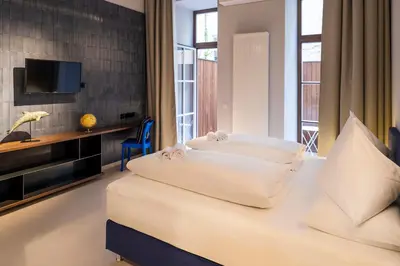 Ein Bett oder Betten in einem Zimmer der Unterkunft grätzlhotel Serviten