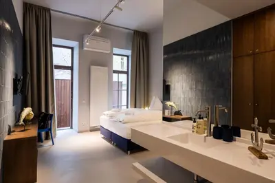 Ein Bett oder Betten in einem Zimmer der Unterkunft grätzlhotel Serviten