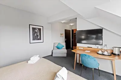Ein Bett oder Betten in einem Zimmer der Unterkunft Hotel George Vienna