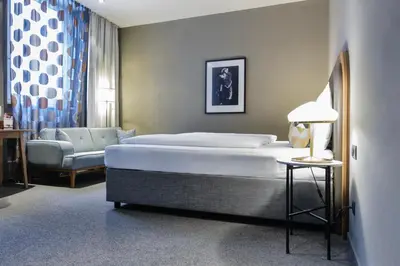 Ein Bett oder Betten in einem Zimmer der Unterkunft Hotel George Vienna