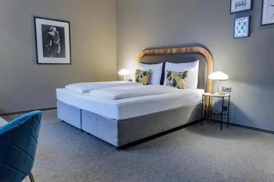 Ein Bett oder Betten in einem Zimmer der Unterkunft Hotel George Vienna