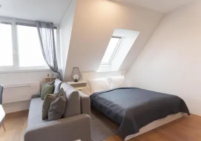 Ein Bett oder Betten in einem Zimmer der Unterkunft Hotel Triester