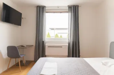 Ein Bett oder Betten in einem Zimmer der Unterkunft Hotel Triester