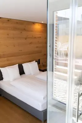 Ein Bett oder Betten in einem Zimmer der Unterkunft geislerAPPARTMENTS