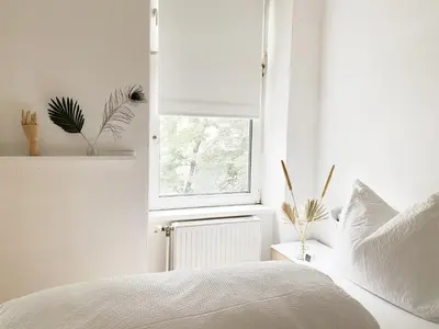 Ein Bett oder Betten in einem Zimmer der Unterkunft Sunny Apartment near Belvedere Castle