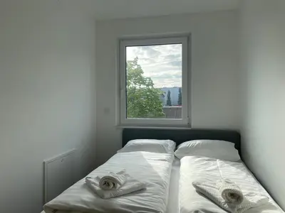 Ein Bett oder Betten in einem Zimmer der Unterkunft STAD10 - Apartments very close to subway U2 Stadlau