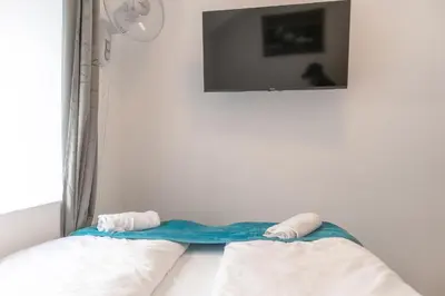 Ein Bett oder Betten in einem Zimmer der Unterkunft Standard 3 Rooms Near Hauptbahnhof
