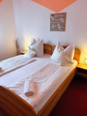 Ein Bett oder Betten in einem Zimmer der Unterkunft Frühstückspension Elena Nicoleta Caltun