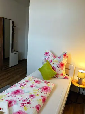 Ein Bett oder Betten in einem Zimmer der Unterkunft Frühstückspension Elena Nicoleta Caltun