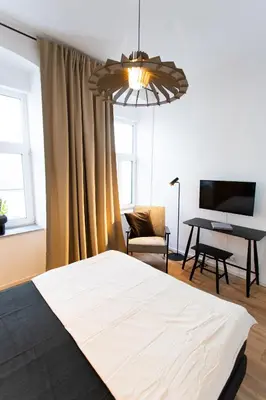 Ein Bett oder Betten in einem Zimmer der Unterkunft Stilvolle Wohnung mit ruhig gelegenem Balkon