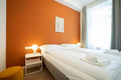 Ein Bett oder Betten in einem Zimmer der Unterkunft Spacious apartment with huge shared terrace and grill located between city centre and Donau river